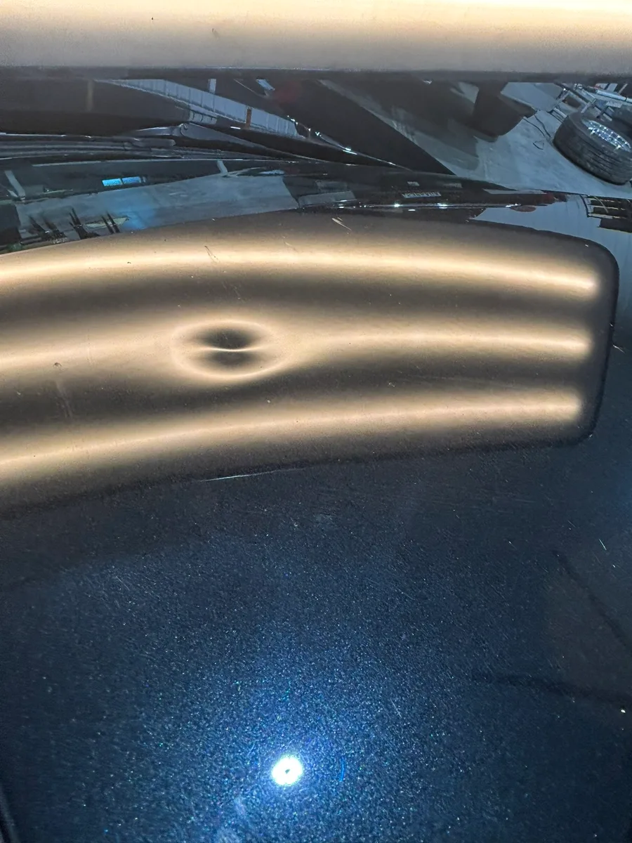 Severe hail dents mapped under LED line-board inspection at the Olathe shop
