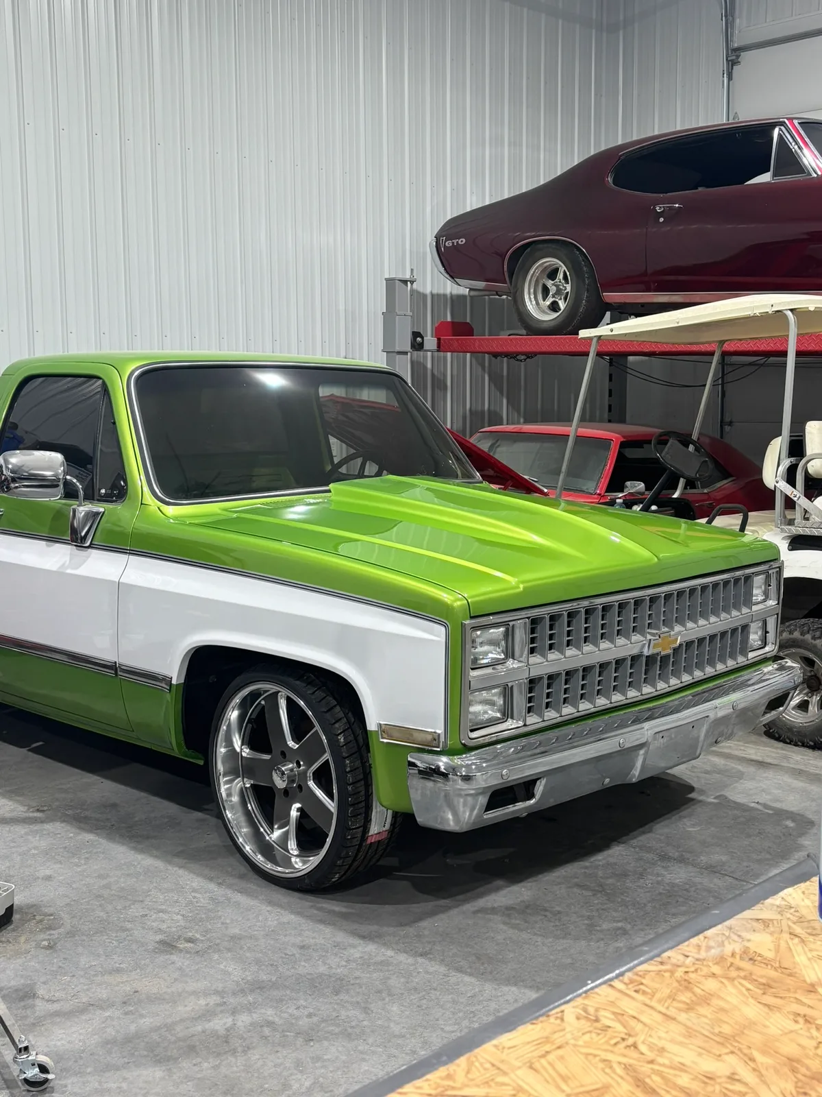 Restored vehicle in a repair bay at the Hail Solutions shop in Olathe, Kansas