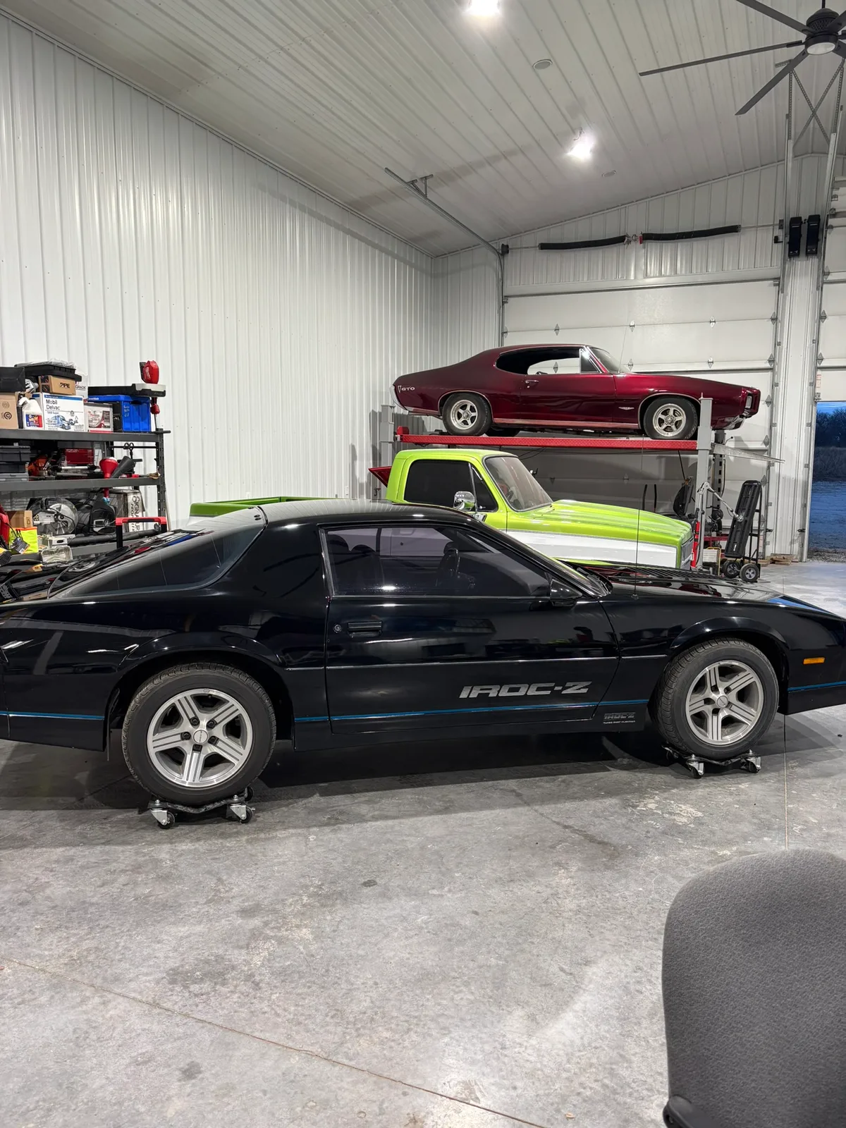 The multi-bay interior of the paintless dent repair shop in Olathe, Kansas